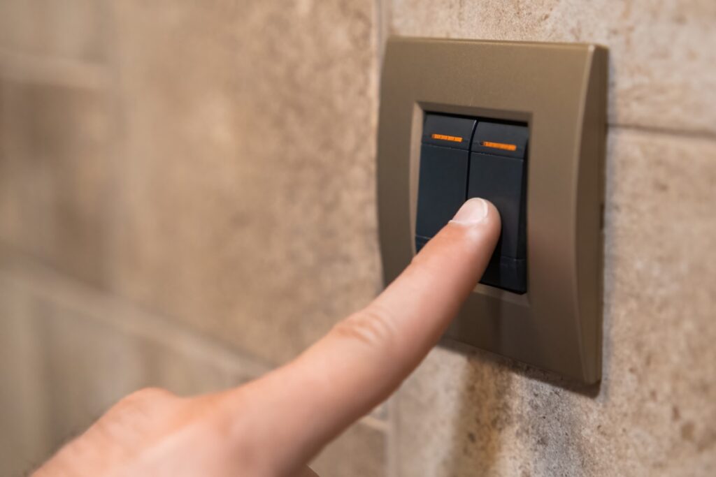 finger pressing dimmer switch