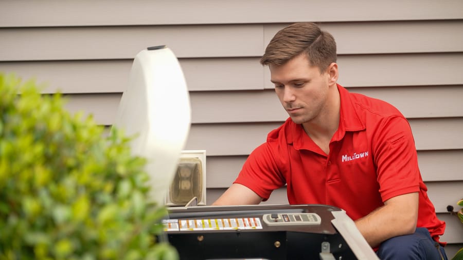 Technician replacing a home generator near Chelmsford, MA